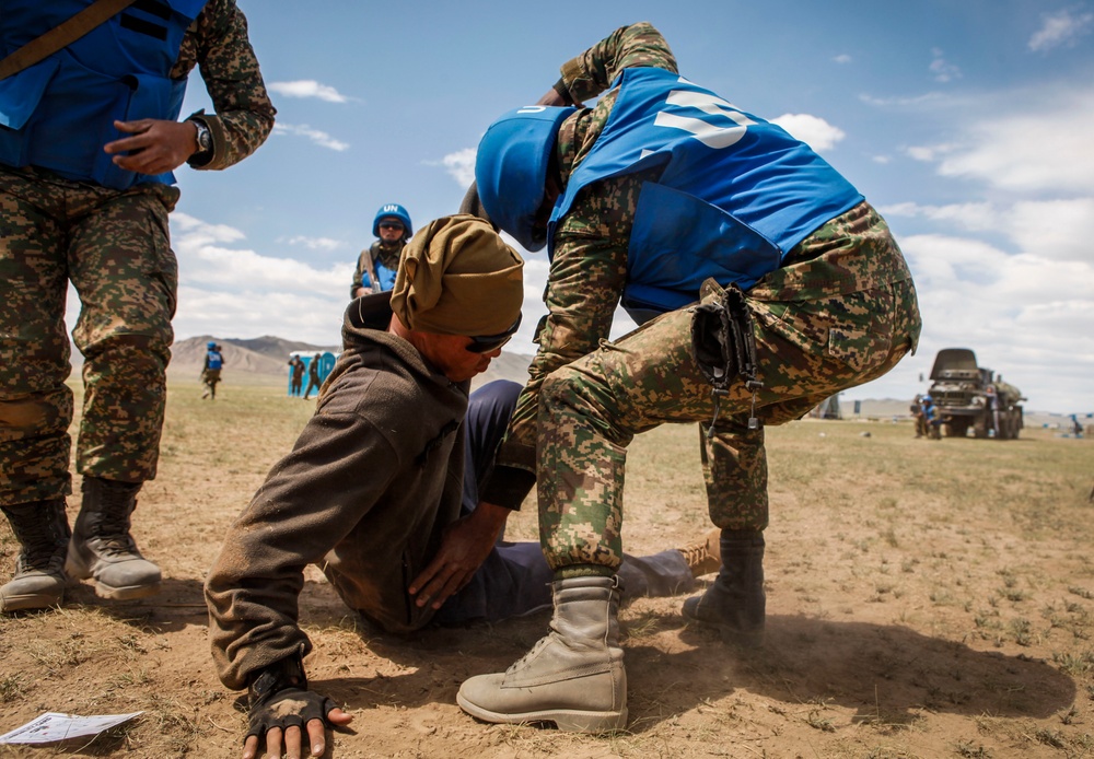 Service members with the Malaysian Army participate in riot control training during Khaan Quest 2016