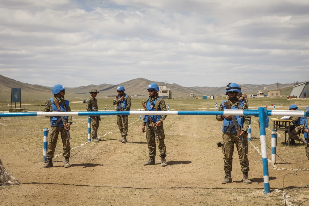 Service members with the Malaysian Army participate in riot control training during Khaan Quest 2016