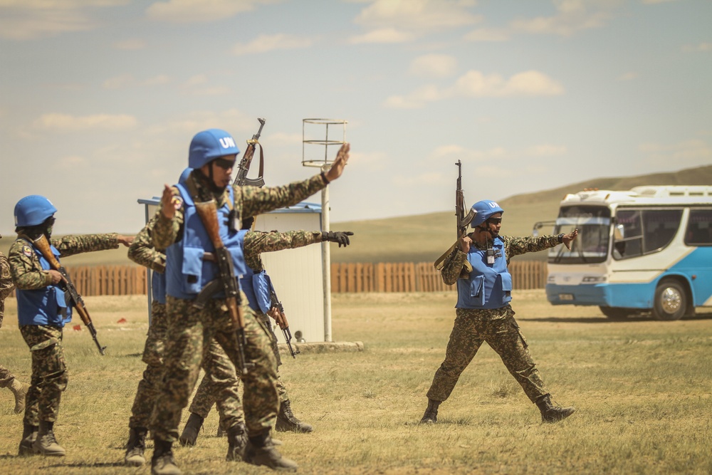 Service members with the Malaysian Army participate in riot control training during Khaan Quest 2016