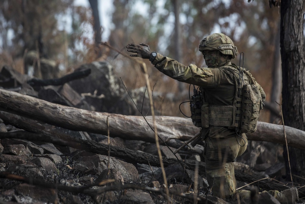 Members of the Australian Army perform synchronized combat arms training