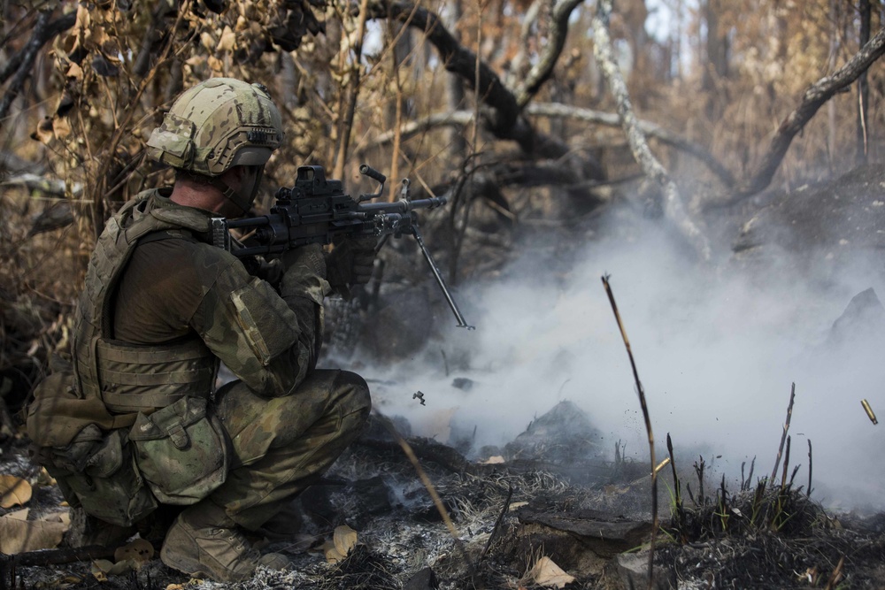 Members of the Australian Army perform synchronized combat arms training