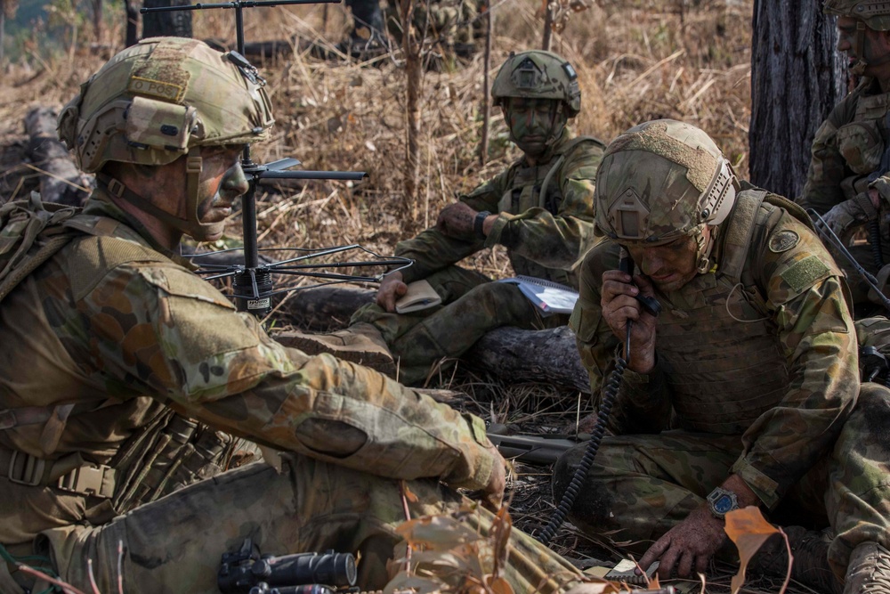 Members of the Australian Army perform synchronized combat arms training