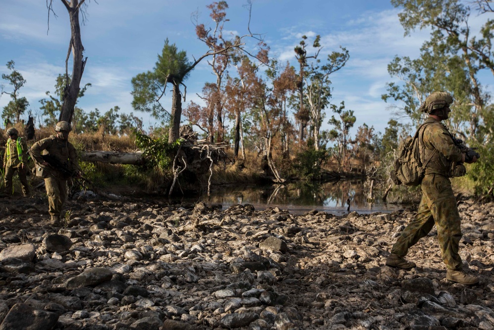 Members of the Australian Army perform synchronized combat arms training