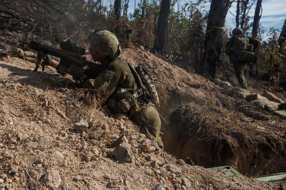 Members of the Australian Army perform synchronized combat arms training