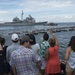 Friends and families of Sailors aboard USS San Jacinto (CG 56) watch from the pier as the ship departs Naval Station Norfolk with the USS Dwight D. Eisenhower Carrier Strike Group (CSG).