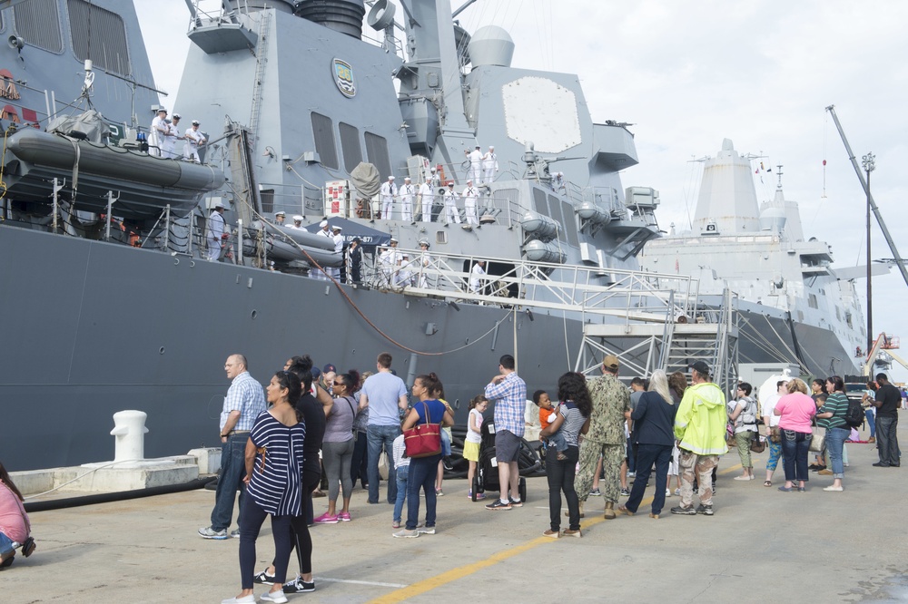 Families line the pier as USS Mason (DDG 87) prepares to depart Naval Station Norfolk.