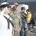 Sailors observe morning colors as the USS Mason (DDG 87) prepares for departure