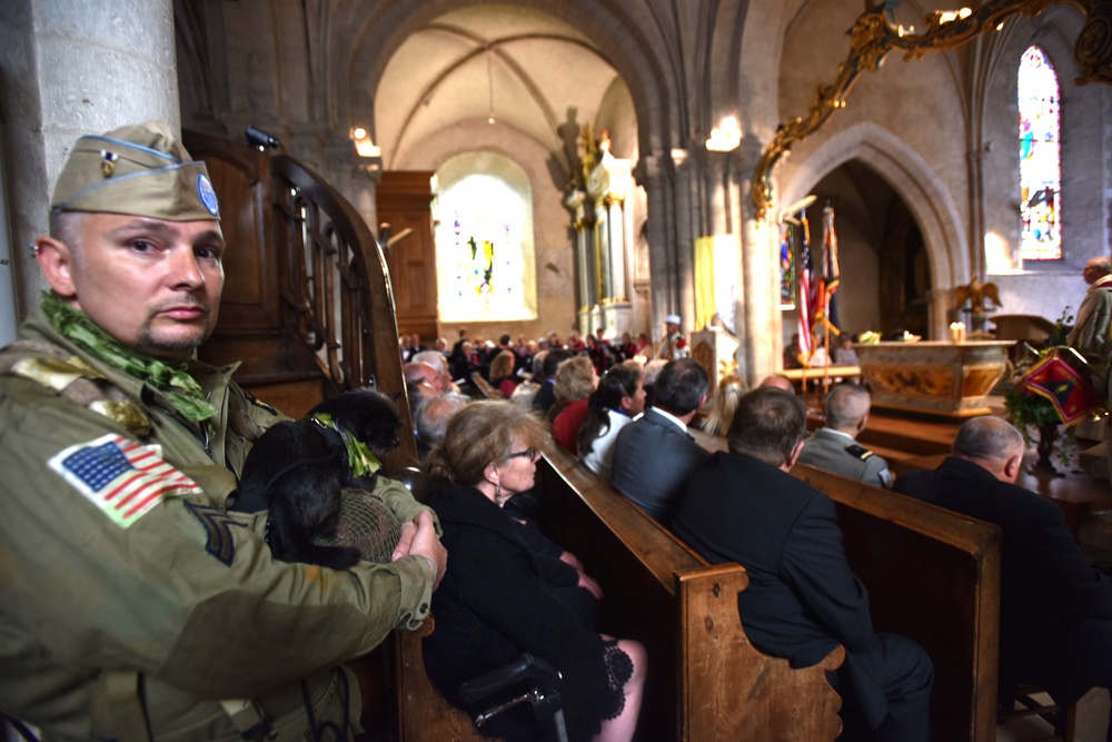 Services inside church of Sainte-Mère-Église commemorate D-Day Invasion