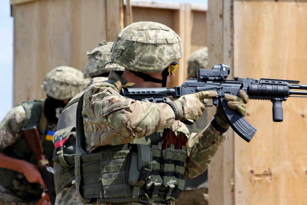 Ukrainian Soldiers prepare to enter and clear a room