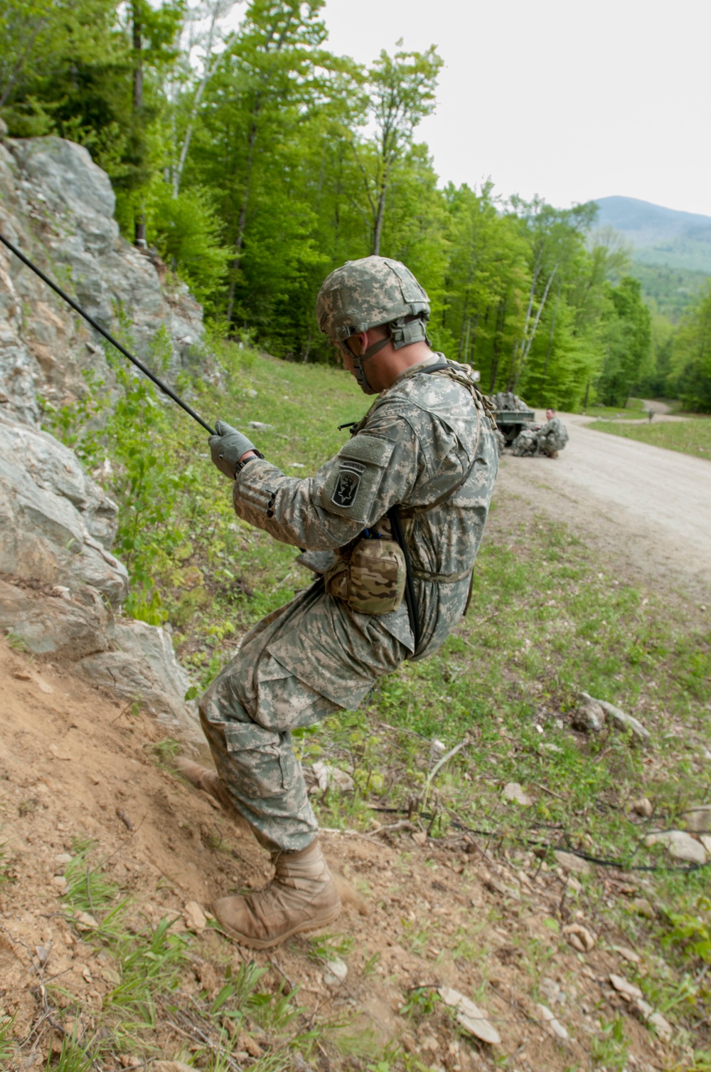 U.S. Army Soldier Lowers Self with Rope