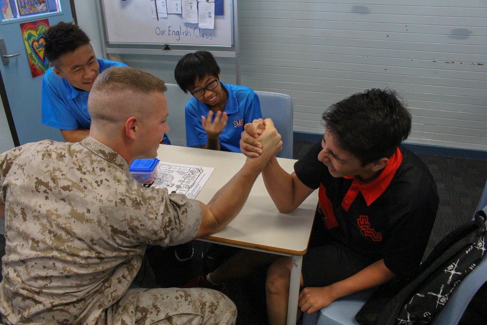 Marines help students learn English