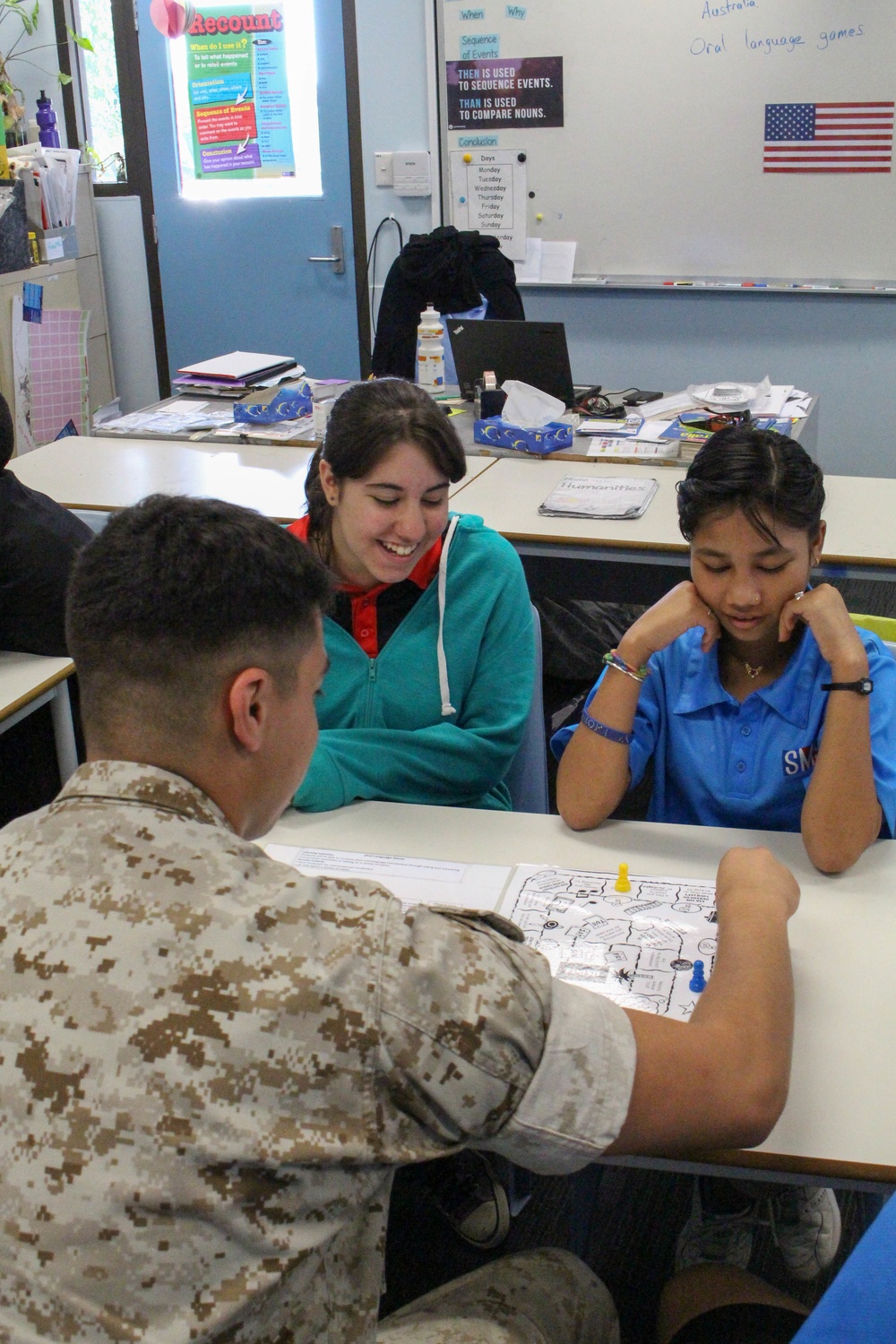 Marines help students learn English