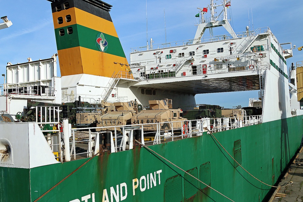 Marines move gear from ship to convoy