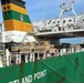 Marines move gear from ship to convoy