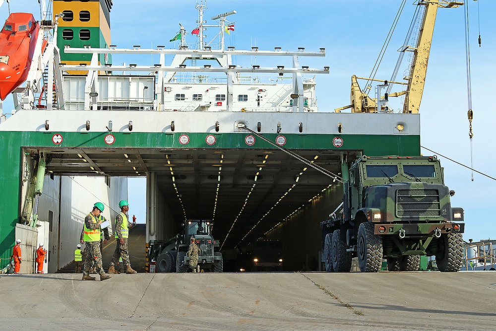 Marines move gear from ship to convoy