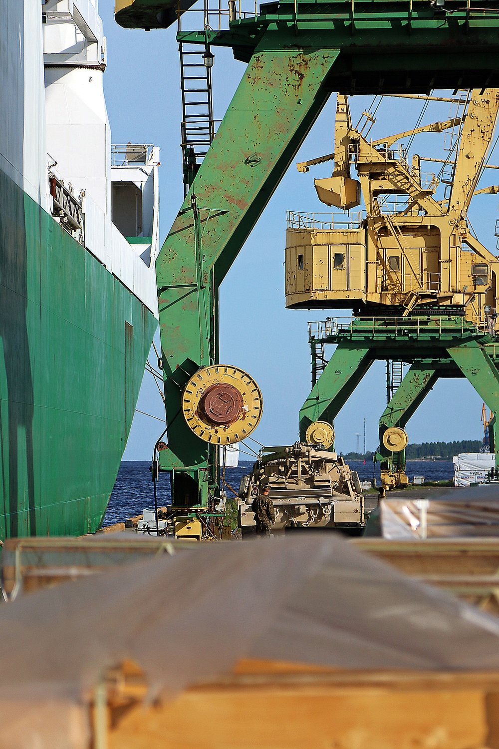 Marines move gear from ship to convoy