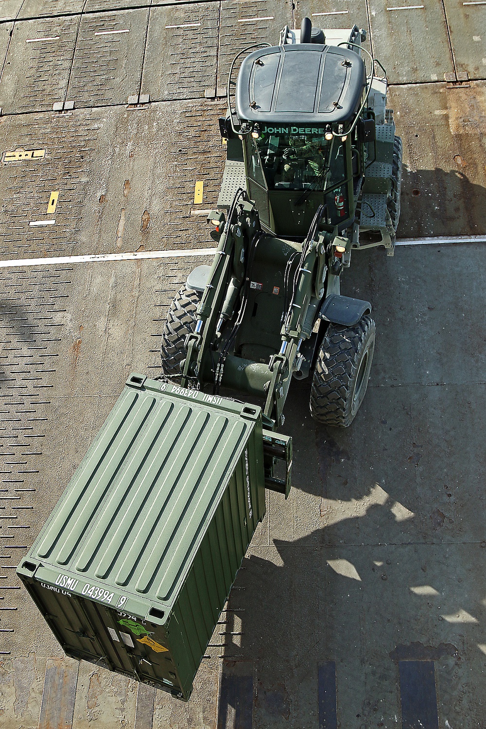 Marines move gear from ship to convoy