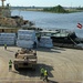 Marines move gear from ship to convoy