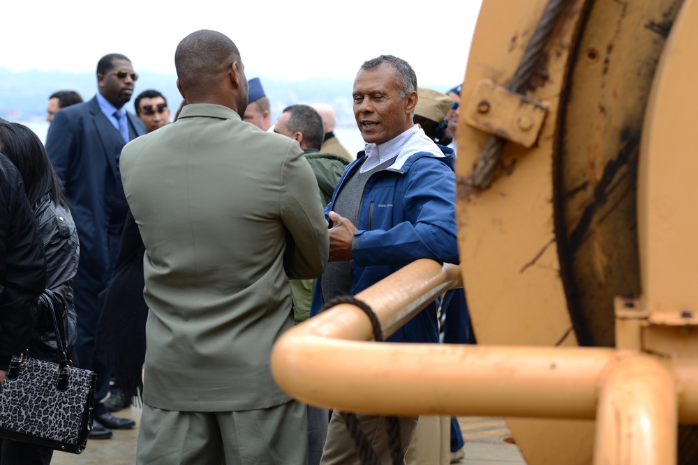 2 members of the Multi-lateral Maritime Counter Drug Seminar speak on the buoy deck of the USCGC Aspen