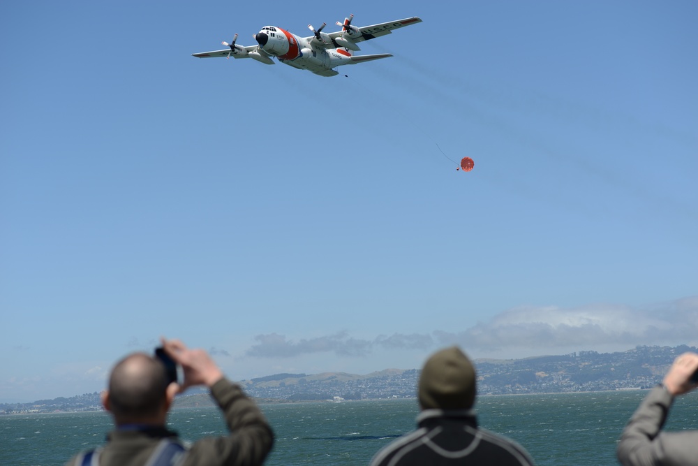An Air Station Sacramento C-130 aircrew demonstrates how to deploy a package in the San Francisco Bay
