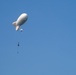 U.S. Army paratroopers jump from a balloon in Belgium