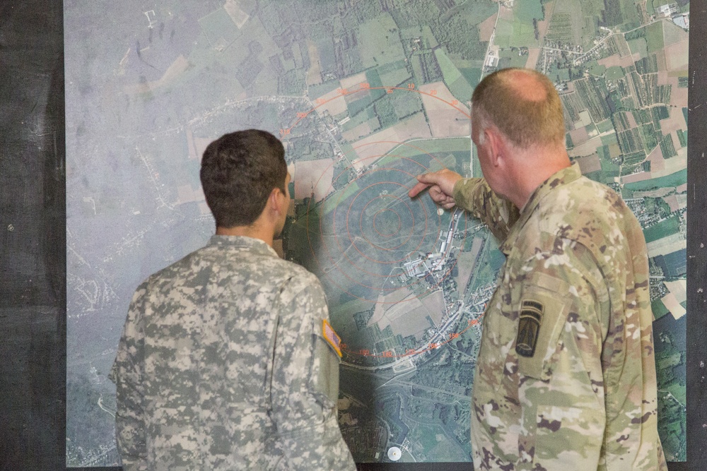 U.S. Army paratroopers jump from a balloon in Belgium