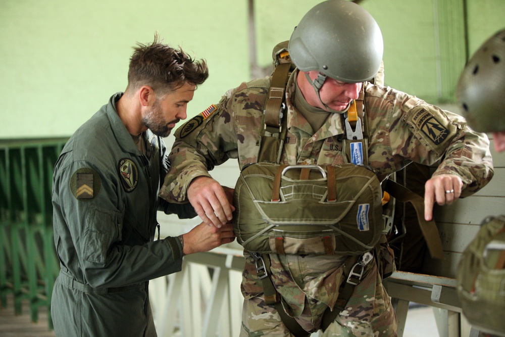 U.S. ARMY PARATROOPERS JUMP FROM A BALLOON IN BELGIUM