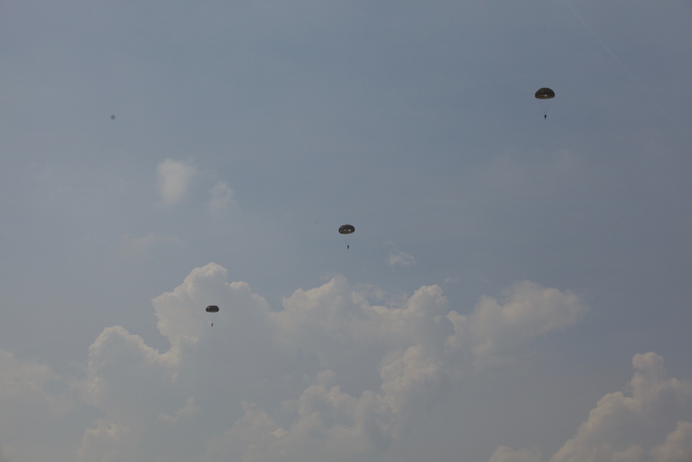 U.S. ARMY PARATROOPERS JUMP FROM A BALLOON IN BELGIUM