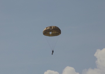 U.S. ARMY PARATROOPERS JUMP FROM A BALLOON IN BELGIUM