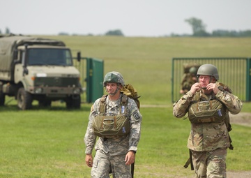 U.S. ARMY PARATROOPERS JUMP FROM A BALLOON IN BELGIUM