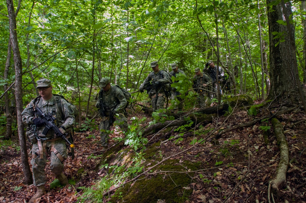 Soldiers Hike Down a Mountain