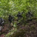 Soldiers Hike Down a Mountain