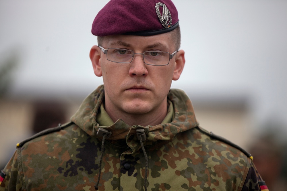 German Soldiers participate in a joint ceremony with U.S. Soldiers in Picauville, France