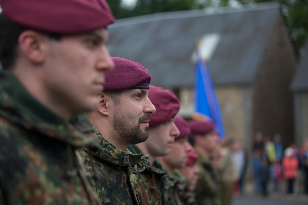 German Soldiers participate in a joint ceremony with U.S. Soldiers in Picauville, France