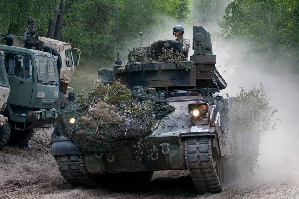 U.S. and Polish Army decontaminate together