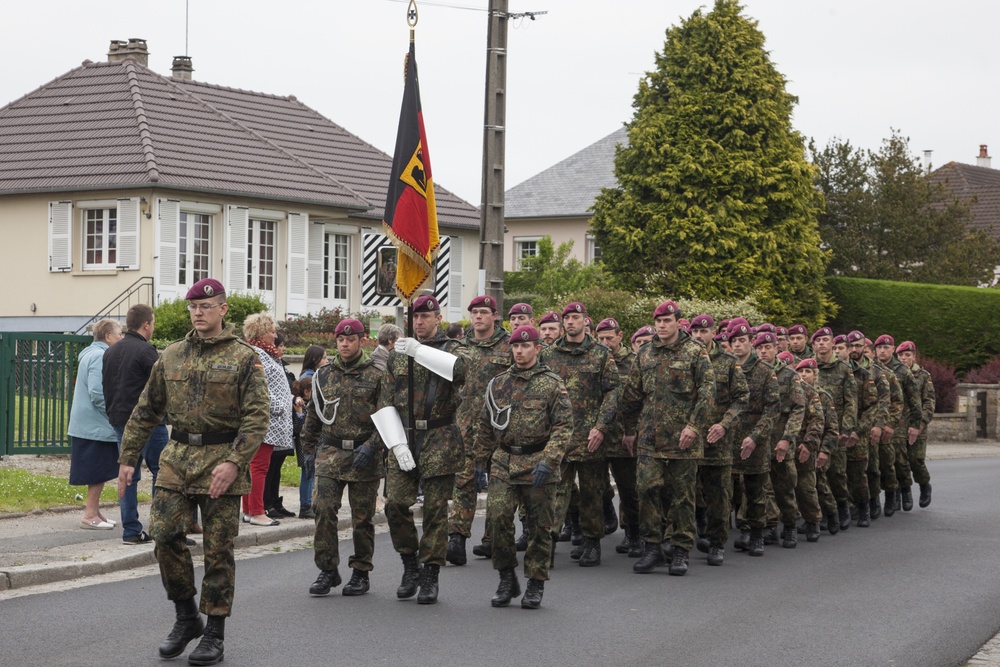 German Soldiers participate in a joint ceremony with U.S. Soldiers in Picauville, France