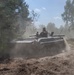 Tankers fly through sand to assault town during Anakonda 16
