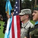 Spc. Mathew Thompson holds the American flag with Guatemalan color guard.