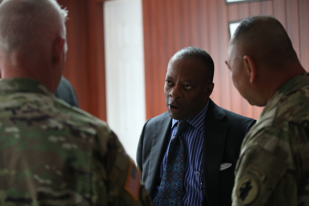 Honorable Todd Robinson speaks with U.S. Army Generals.