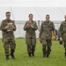 U.S. Army soldier gives MREs to a German Soldiers waiting for transportation