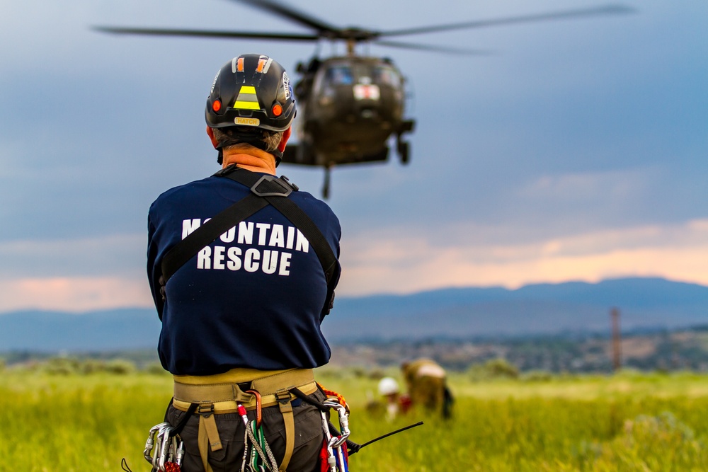 Mountain rescue volunteer watches hoist training