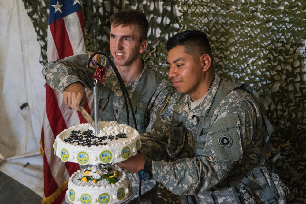 Army Reserve Soldiers bake an Army birthday cake
