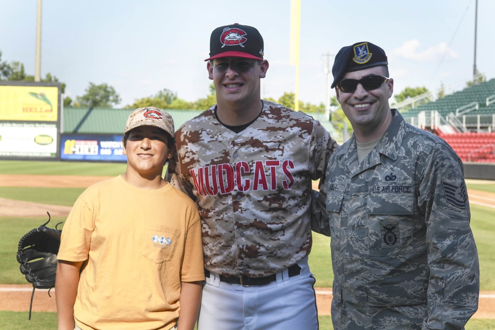 SJ Airman throws the first pitch