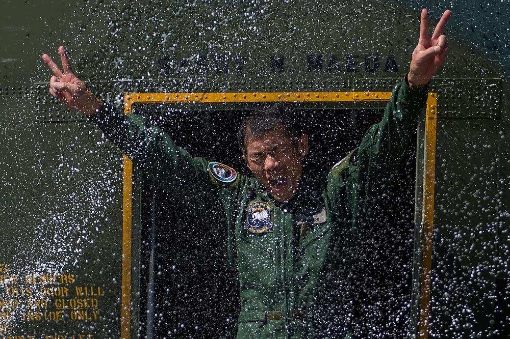 Japanese Air Defense Force Chief Master Sgt. Takanori Konishi celebrates 10,000 flight hours.