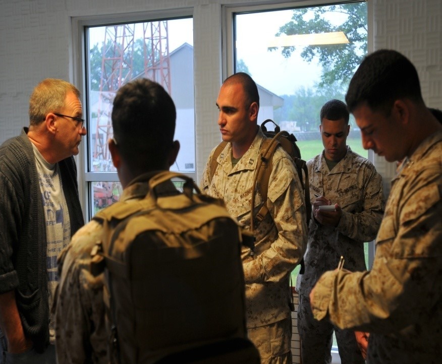 Marines speak with locals