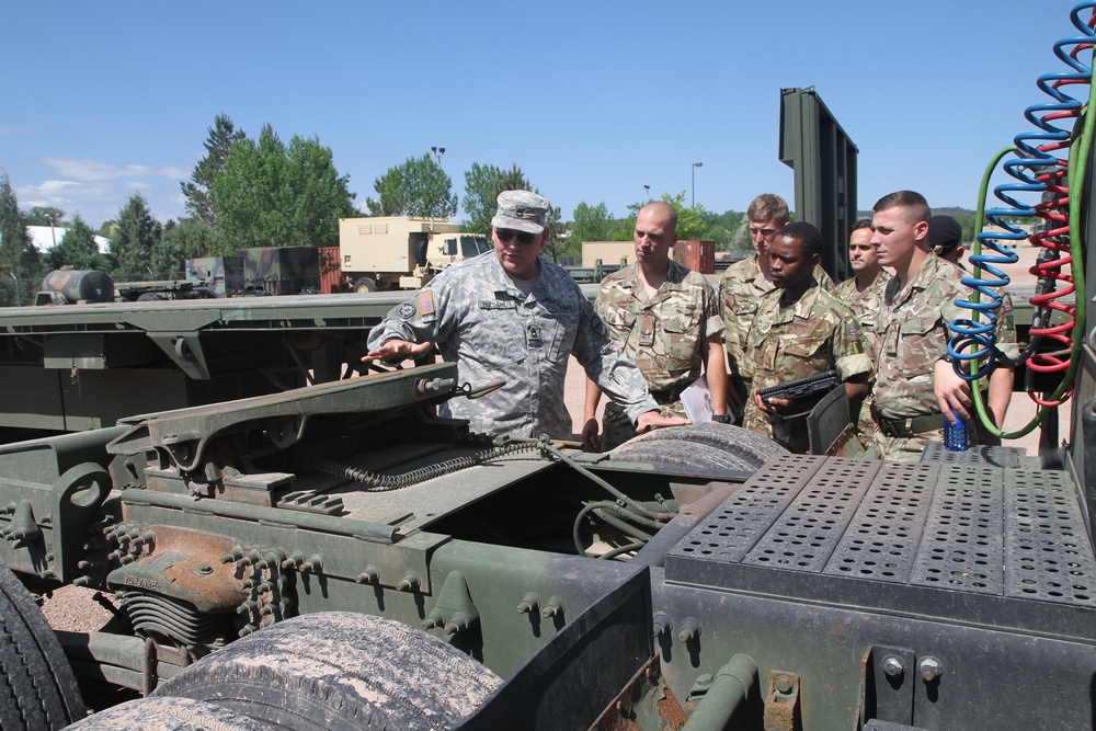 Scottish Soldiers drive American trucks