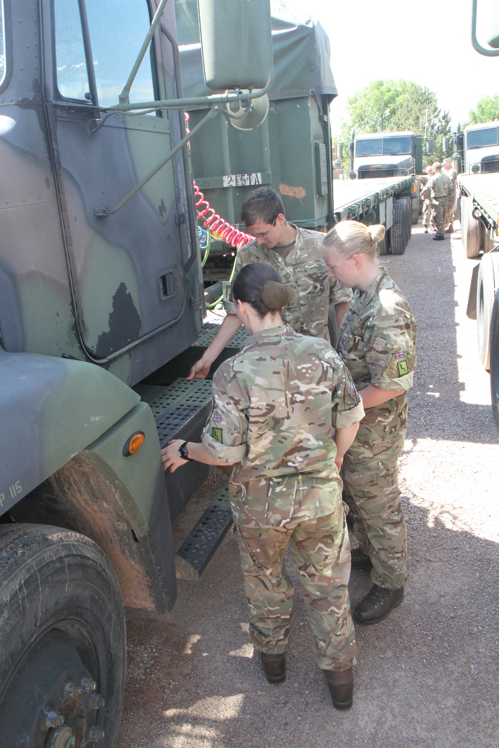 Scottish Soldiers drive American trucks