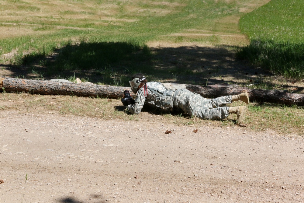 Soldier low crawls to shoot photo