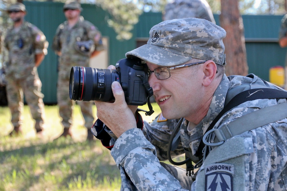 Soldier takes photo during briefing