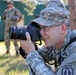 Soldier takes photo during briefing